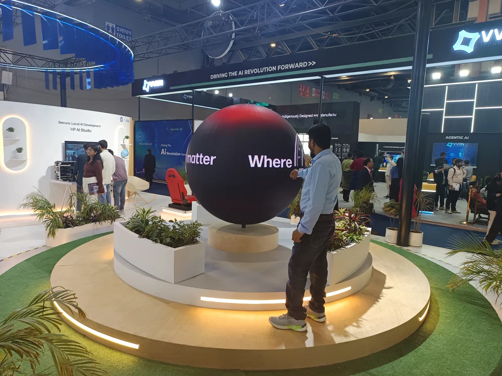 The AI Impact Summit 2026 expo hall with AI installations and technology booths
