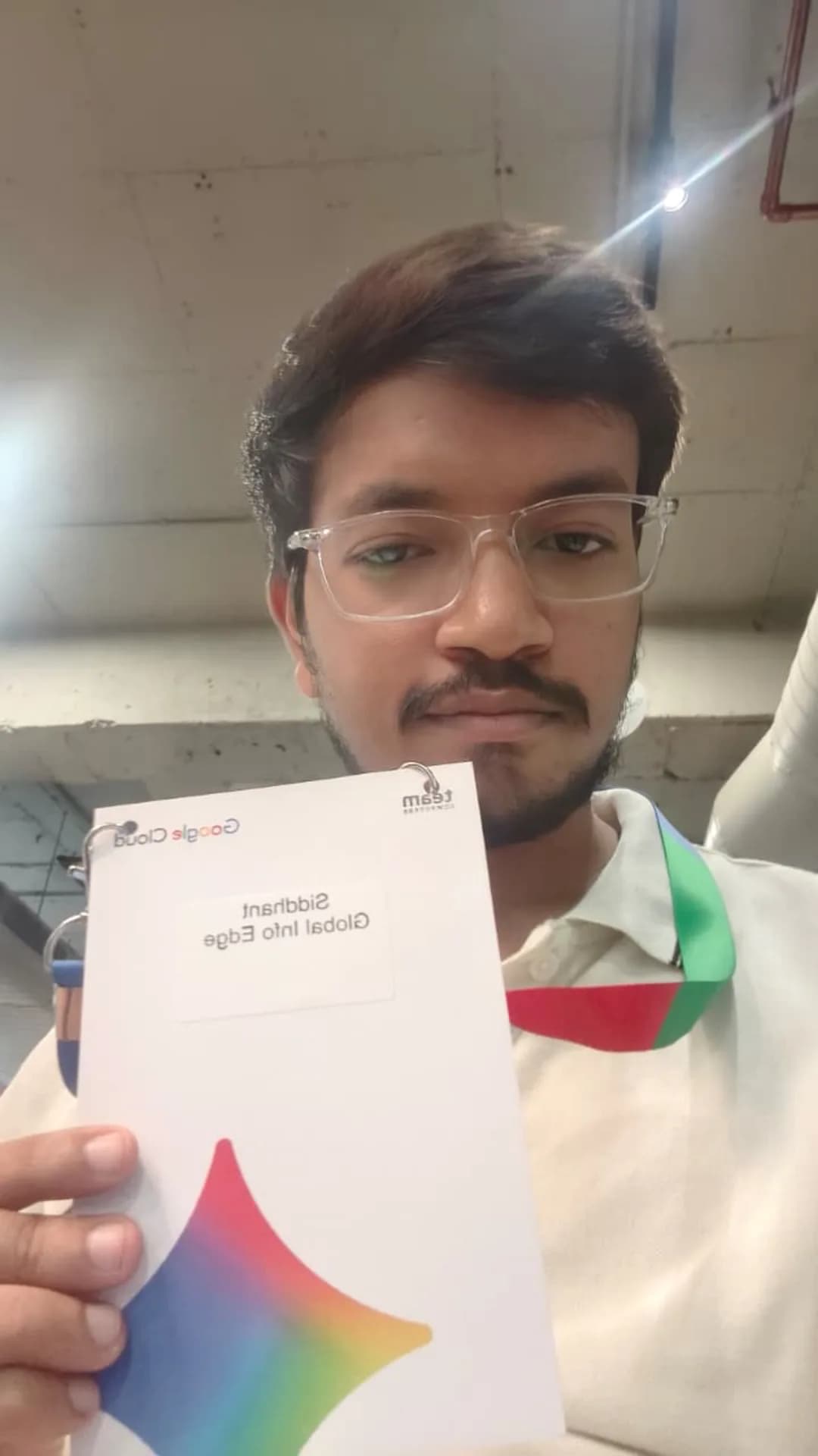 Global Info Edge team member with the Google Cloud and Team Computers event badge